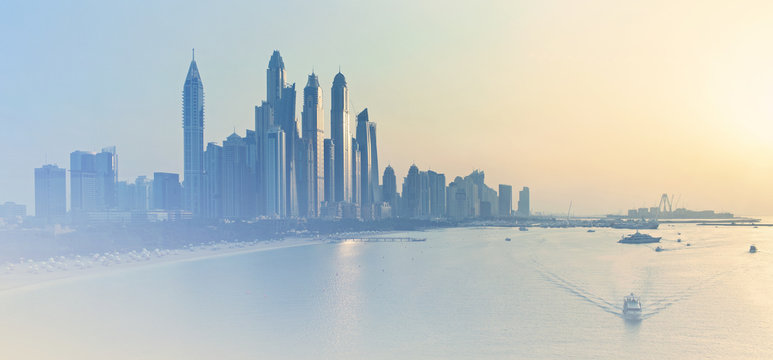 Dubai Marina skyline illuminated by evening sunlight