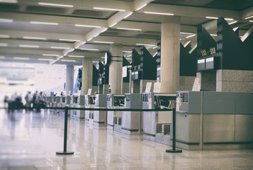 Check-in in modern international airport terminal.