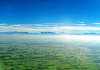 Aerial view of Alps and farmlands in Germany. - obrazy, fototapety, plakaty