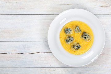  creamy polenta with melted gorgonzola cheese