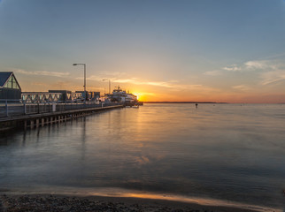 sunset over ferry dock