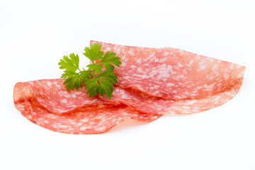 Salami smoked sausage slices isolated on white background cutout.