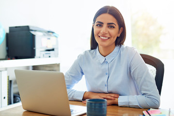 Smiling friendly young businesswoman