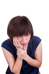 Fototapeta premium Asian woman suffering intense toothache pain with hands over face