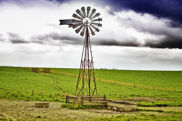 Windmill and cloudy sky © pbombaert