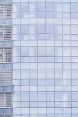 Business Modern architecture close up, texture windows of a high rise building
