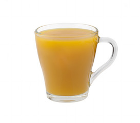 Yellow juice in a glass cup on a white background without shadows