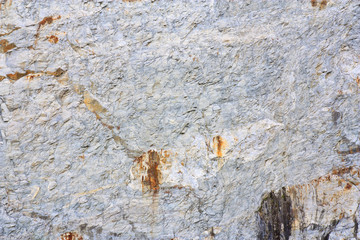 stone or rock wave texture gray and yellow wall or floor on mountain cliff for background or wallpaper