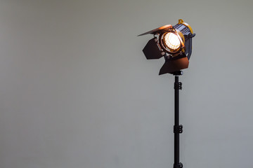 Spotlight with halogen bulb and Fresnel lens. Lighting equipment for Studio photography or videography.