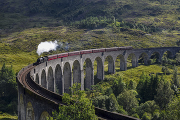 Jacobite steam train on Glenfinnan Viaduct approaching