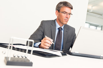 Manager Sitting At His Desk