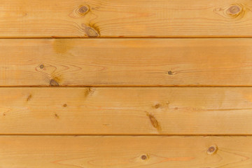 Fototapeta premium close up of wall made of wooden planks. brown texture background.