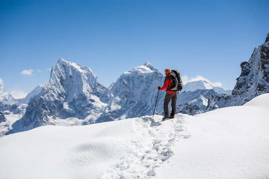 Trekker is walking by Renjo La pass in Everest region