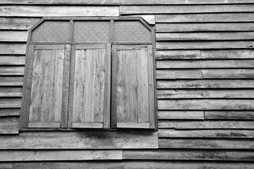 Old wooden house wall with wooden window. texture background