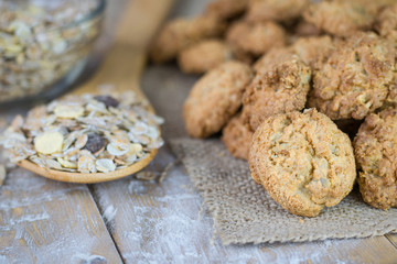 Homemade biscuits and granola on a rustic wooden table.