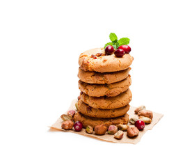 Stack  of oat cookies with cranberry and pistachio isolated on white