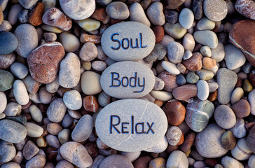 Words Soul, Body and Relax written on stones