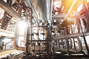 Equipment, cables and piping as found inside of a modern industrial power plant