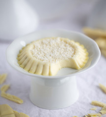Panna Cotta with with chocolate on light background. North Italian dessert from cream, sugar and vanilla.
