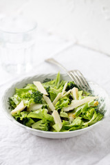 Detox salat with pear, parmesan cheese, olives, arugula and broccoli. Vegetarian food concept