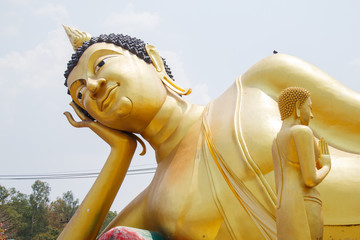 Big Golden Reclining Buddha, Wat Kok Mai Daeng, Phitsanulok Province, Thailand.