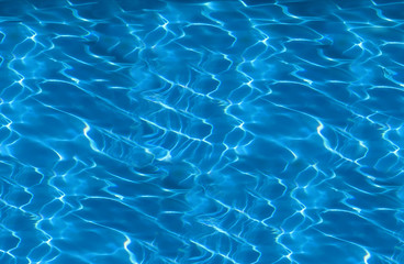 beautiful clear pool water reflecting in the sun background