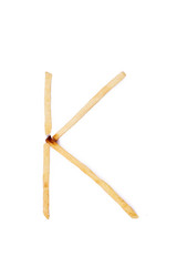 Alphabet letter K laid with french fries. Alphabet letter food.