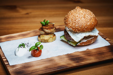 Lunch on the table from a hamburger with potatoes