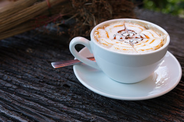 Cappuccino cup  on old wooden table