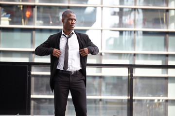 Portrait of a businessman in front of skyscrapers