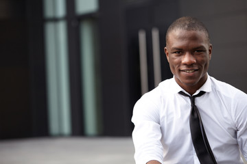 Portrait of a businessman in front of skyscrapers