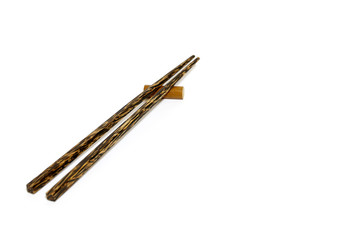 Wooden chopsticks on white background