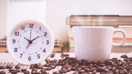 Coffee cup and coffee beans with vintage color effected