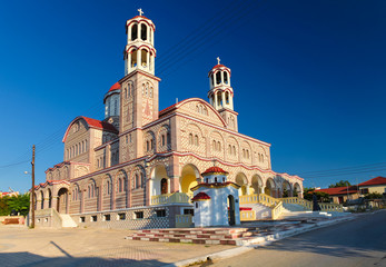 Fototapeta na wymiar Church of Agios Georgios is a greek orthodox church in village Nea Potidaia (Nea Poteidea) in the evening in peninsula Kassandra, Chalkidiki, Greece