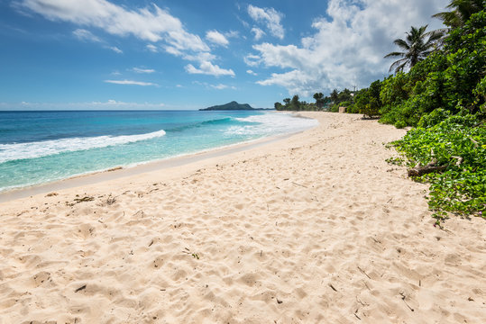 Sunny day on Anse Nord D'Est beach in the north of Mahe Island, Seychelles