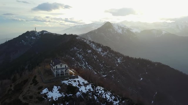 4K aerial view of a italian mountain church. Italian Alps, Trivero, Piemonte, Italy.