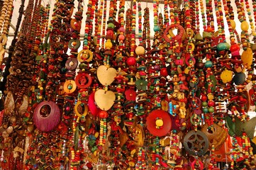 Necklaces hanging on a stall of Feira Hippie Sunday market in Rio de Janeiro