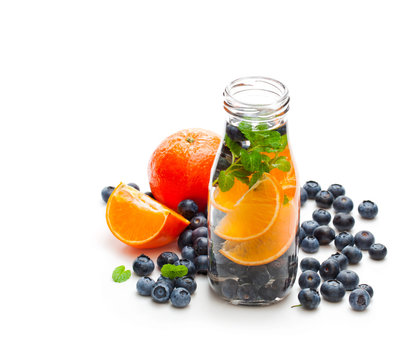 detox  organic blueberry and orange drink isolated on white