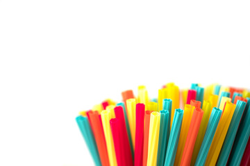 Pile of colorful straws isolated with white background.