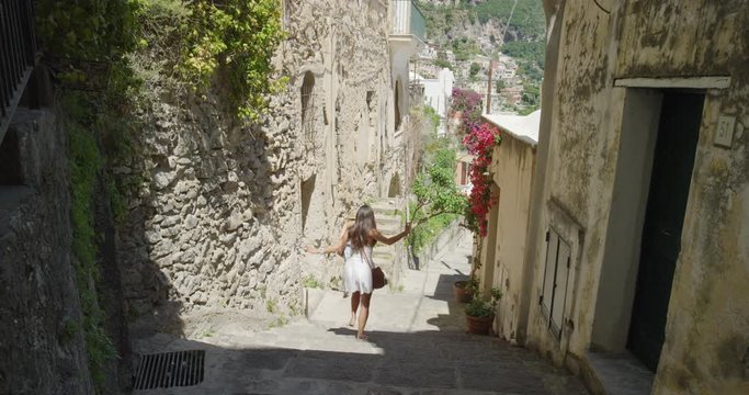 Girl friends walking in Italian street exploring European town Tourist women travelling in beautiful Italy Best friends enjoying summer vacation travel adventure