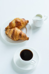 Breakfast. Coffee with milk and croissants. View from above.