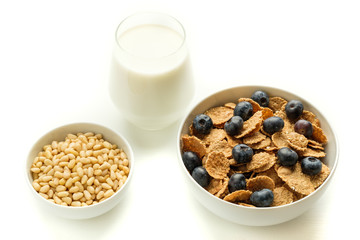 Healthy food. Multi grain flakes with blueberry and milk for breakfast.