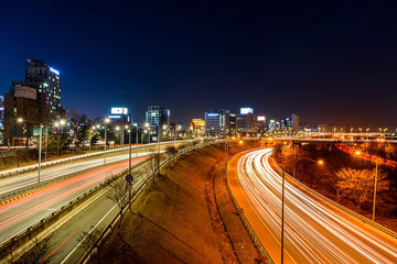 Fototapeta na wymiar Light trails on a highway at night