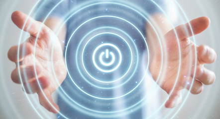 Businessman holding 3D render power button with his hand