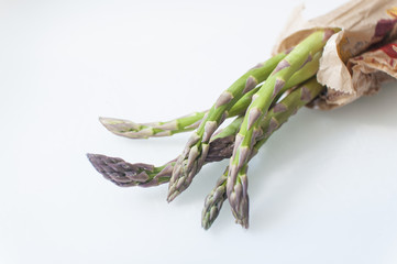 isolated fresh green asparagus with copy space and white background