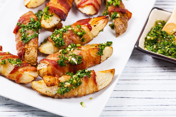 Bacon Wrapped Potatoes with Parsley Garlic Pesto Sauce. Selective focus.