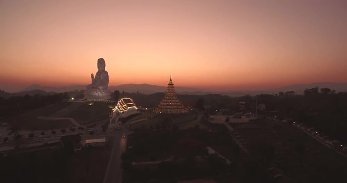 Dusk Over Huay Pla Kung Temple in Chiang Rai, Thailand, Aerial Drone Footage
