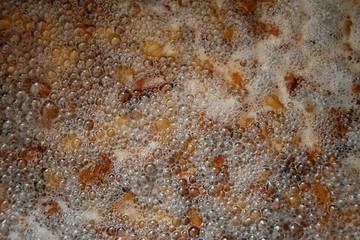 Pork greaves in a sizzling pot