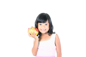 Young girl holding piggy bank on white background.saving money concept.