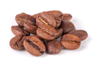 Pile of coffee beans isolated on white background